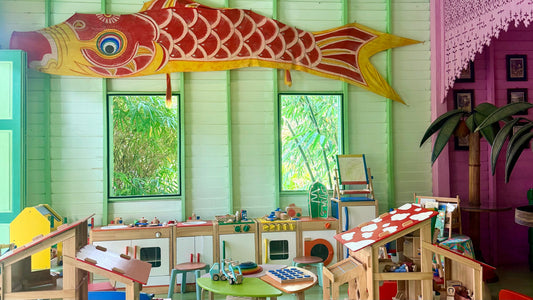 Playroom at Grandfather's House with a large red and yellow koi kite on the green wall