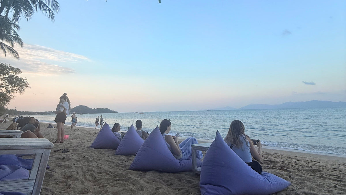View from Wave in Fishermans Village, Koh Samui.  People on beanbags looking out to sea.