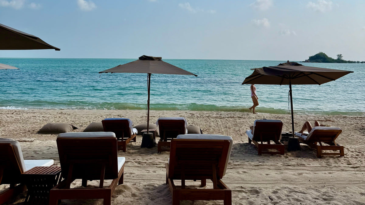 Parasols on Choeng Mon beach at Sala Choeng Mon hotel
